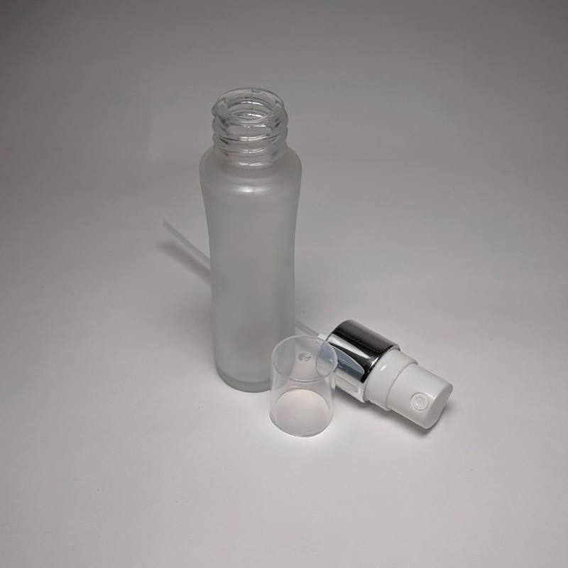 Attractive design 25ml unique shape glass bottle color customization mist sprayer with PP plastic cap silver collar