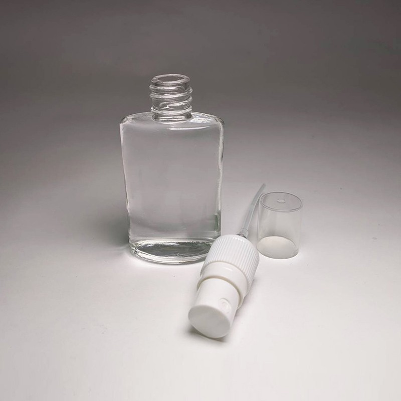 Multifunctional empty glass bottle 35ml oval glass bottle for cosmetic skincare and hand sanitizer packaging