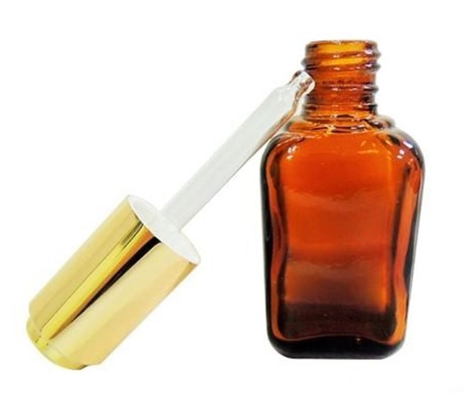 cosmetics oil bottle with amber dropper application
